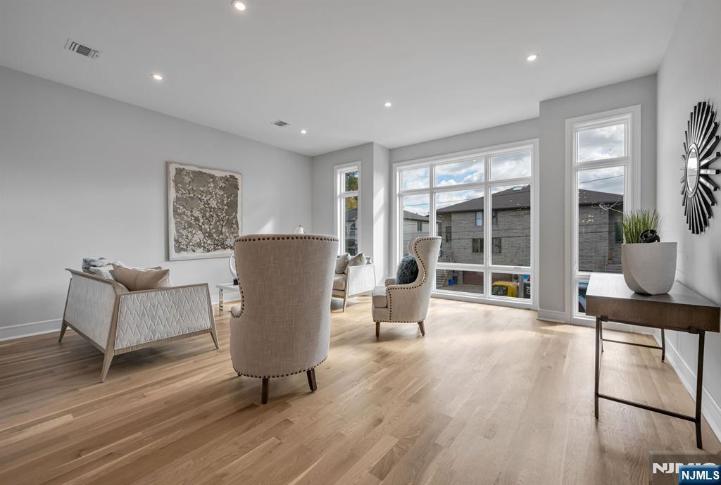 2449 Camner Street Fort Lee, NJ 07024 - Photo 3 of 47 a living room with furniture and a wooden floor