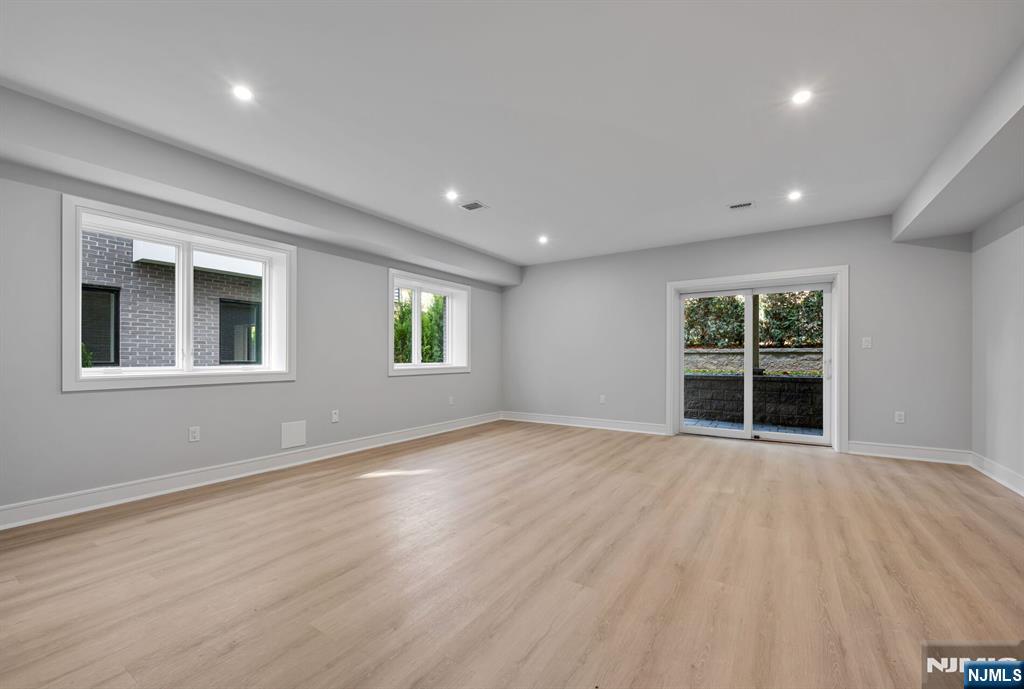 2449 Camner Street Fort Lee, NJ 07024 - Photo 36 of 47 a view of an empty room with wooden floor and a window
