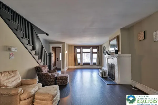 a living room with furniture and a fireplace