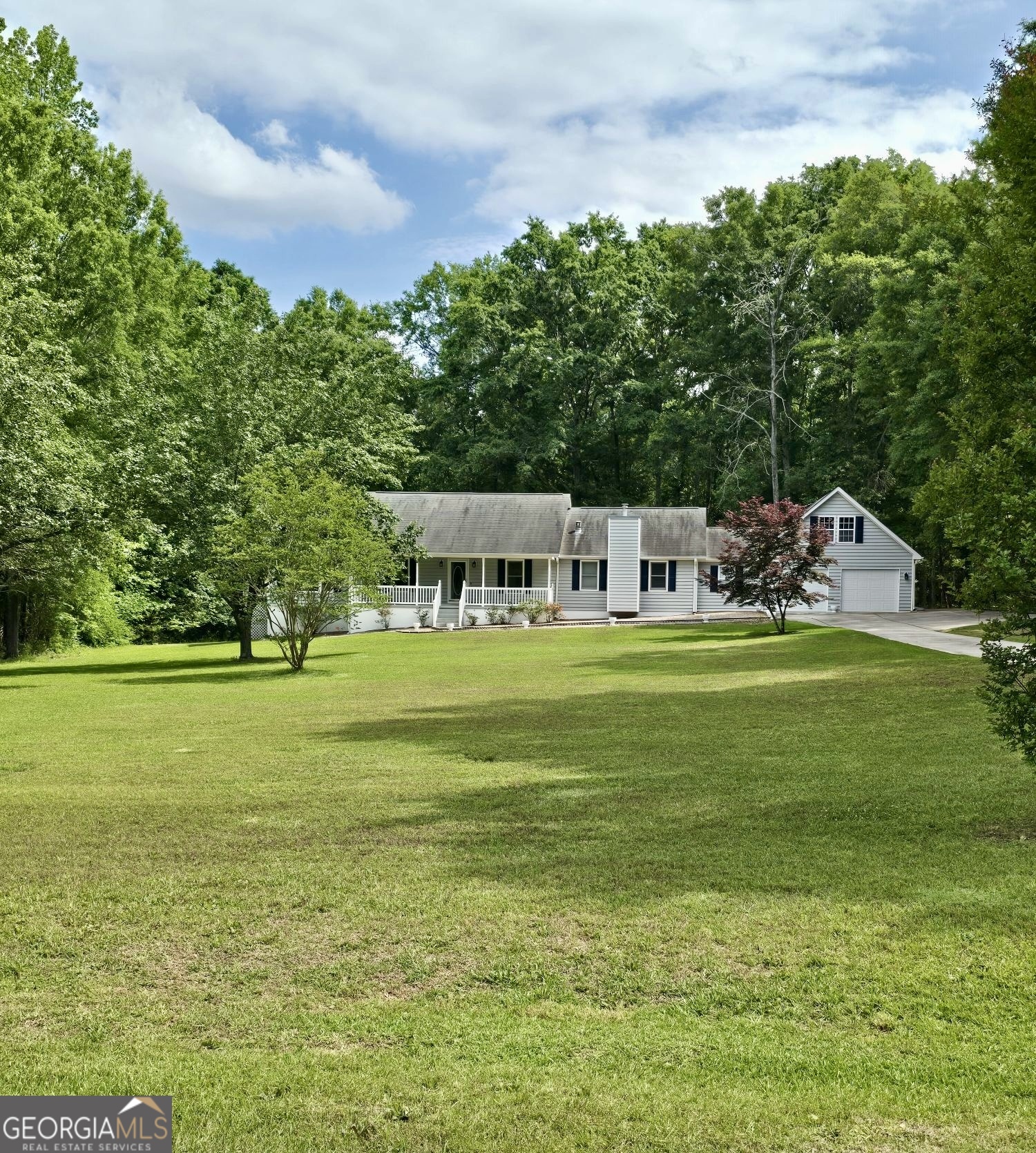 423 Woods Road Brooks, GA 30205 - Photo 2 of 48 a view of house with a big yard