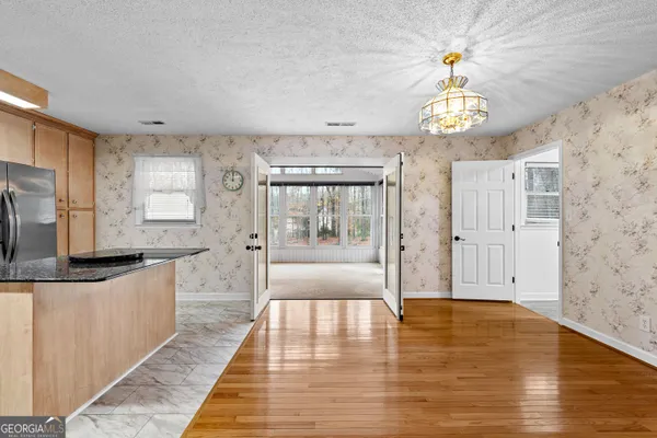 a view of an empty room with a sliding door