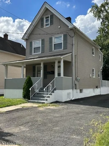 a view of a house with backyard and windows