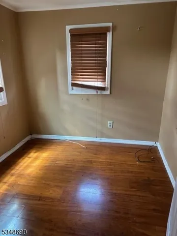 a bathroom with a tub a sink a mirror and a bathtub