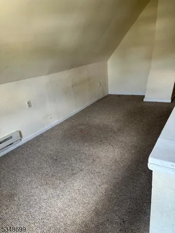 a bathroom with a toilet sink and window