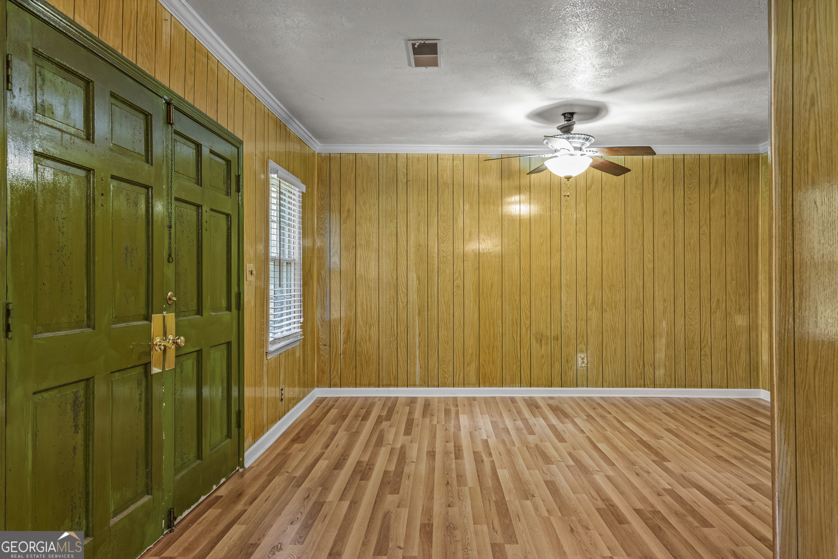 724 Hill Street Madison, GA 30650 - Photo 12 of 36 a view of a hallway with wooden floor