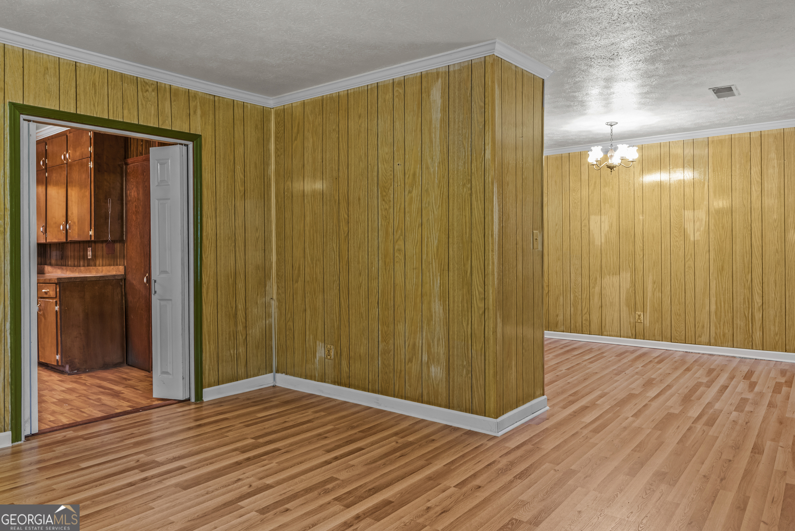 724 Hill Street Madison, GA 30650 - Photo 14 of 36 a view of a hallway with wooden floor