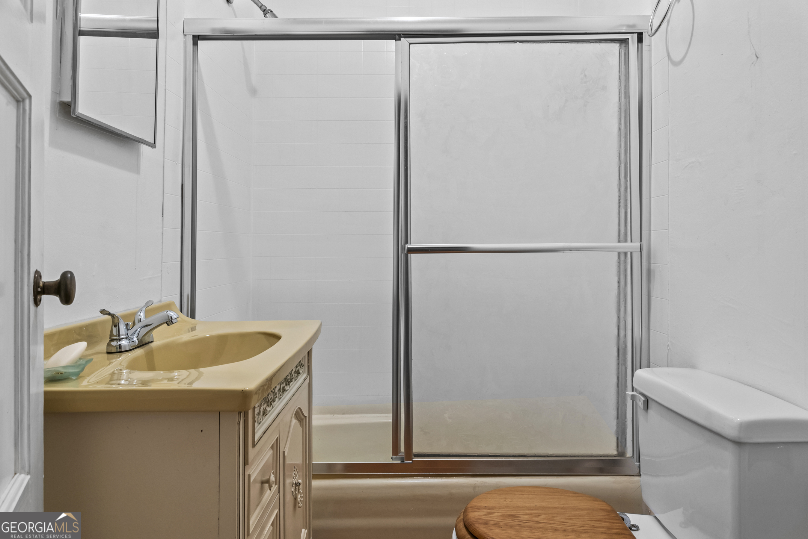 724 Hill Street Madison, GA 30650 - Photo 22 of 36 a bathroom with a sink and a toilet