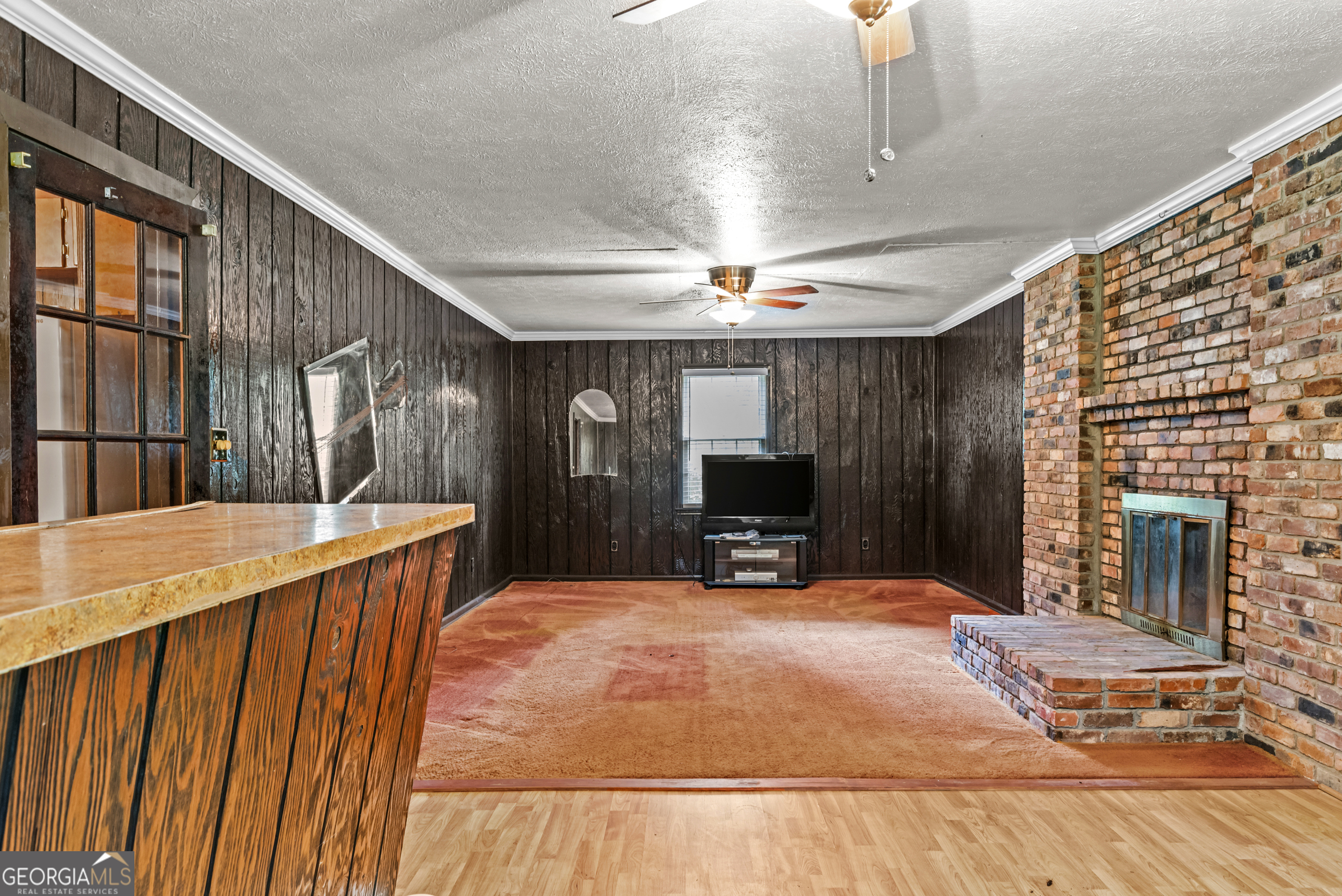 724 Hill Street Madison, GA 30650 - Photo 34 of 36 a view of a kitchen with a sink and a fireplace