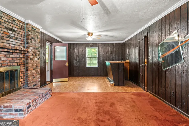 a room with shower curtain and a window