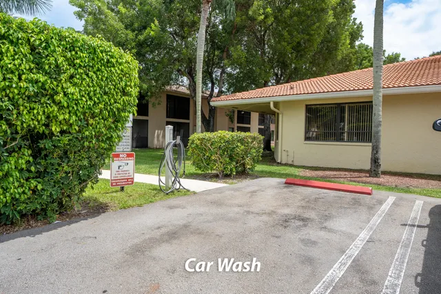 a view of a house with a small yard and plants