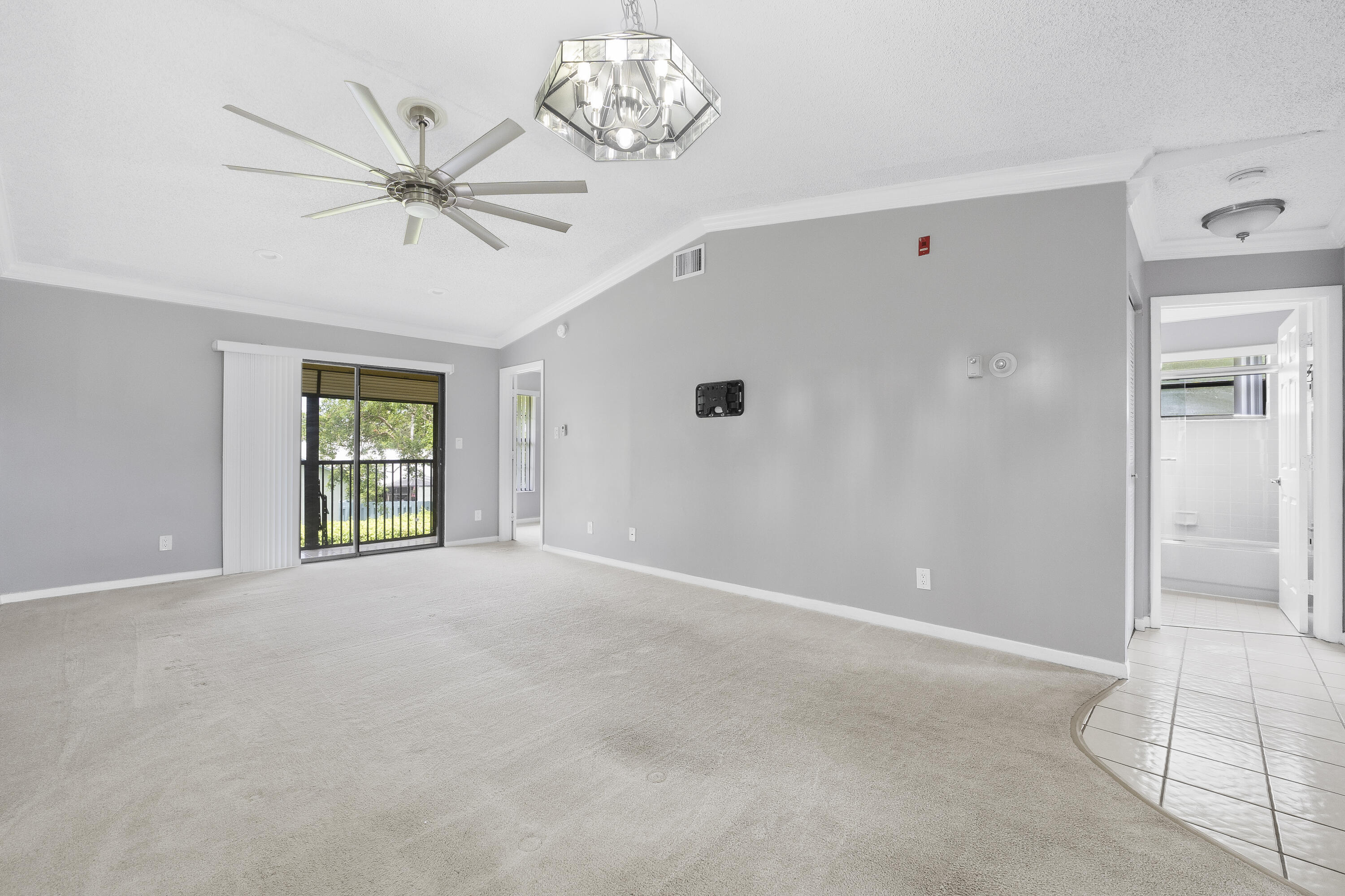 9413 Boca Cove Circle, Unit 1107 Boca Raton, FL 33428 - Photo 6 of 32 a view of an empty room with a window