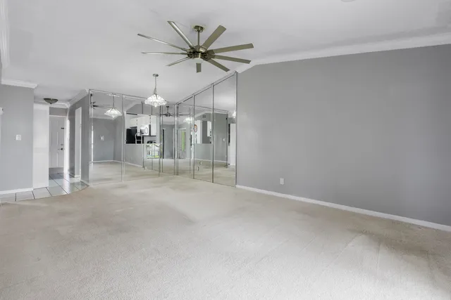 a view of a livingroom with a ceiling fan