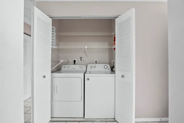 a utility room with dryer and washer