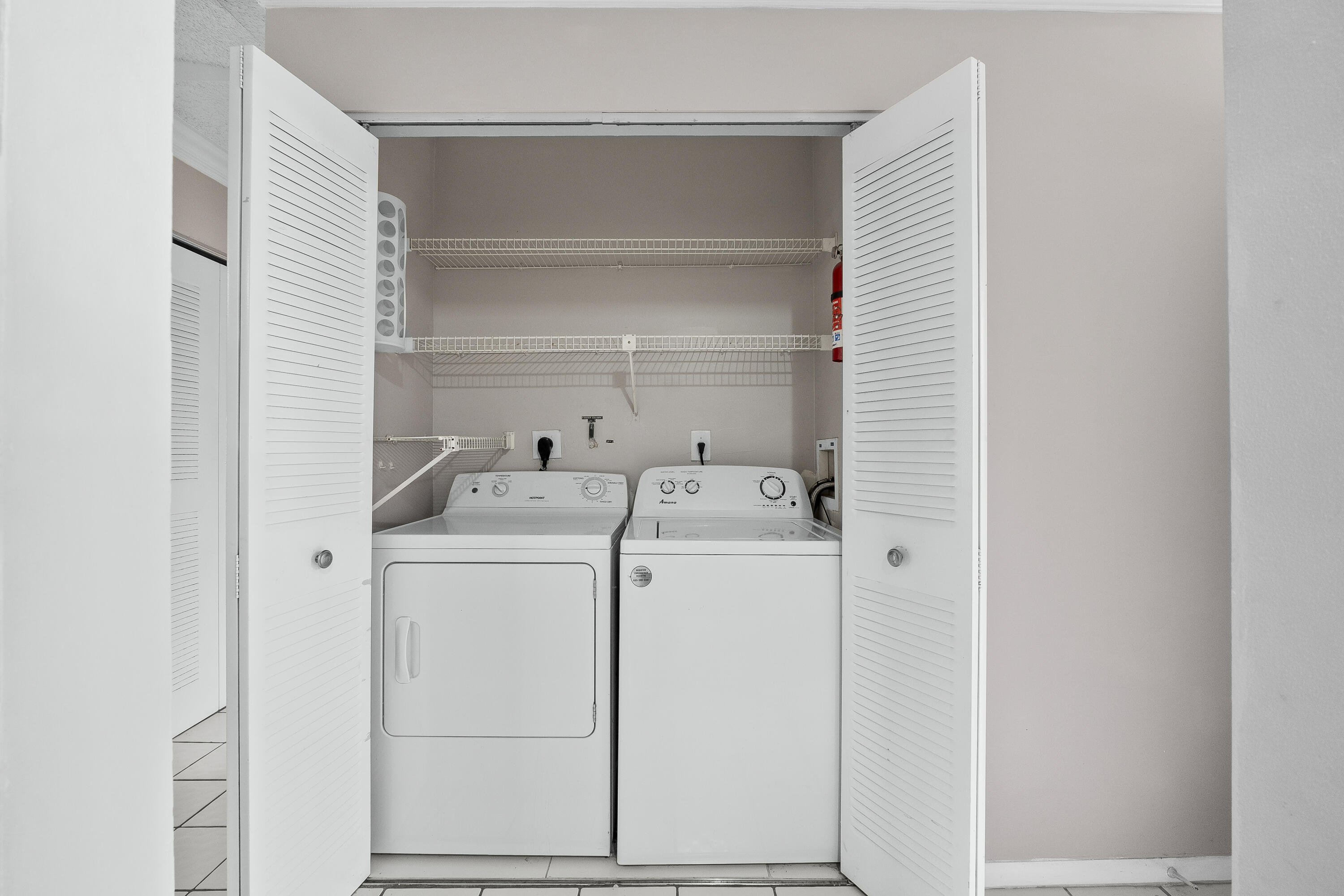 9413 Boca Cove Circle, Unit 1107 Boca Raton, FL 33428 - Photo 10 of 32 a utility room with dryer and washer