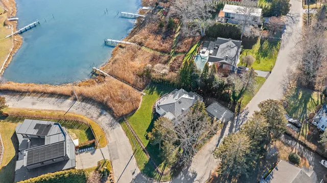 an aerial view of a house with outdoor space