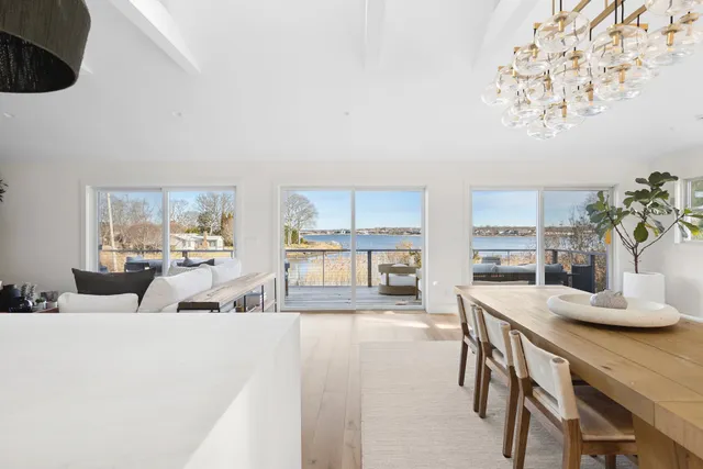 a living room with furniture and view of kitchen