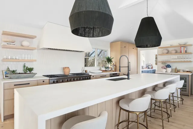 a kitchen with stainless steel appliances a sink and a stove