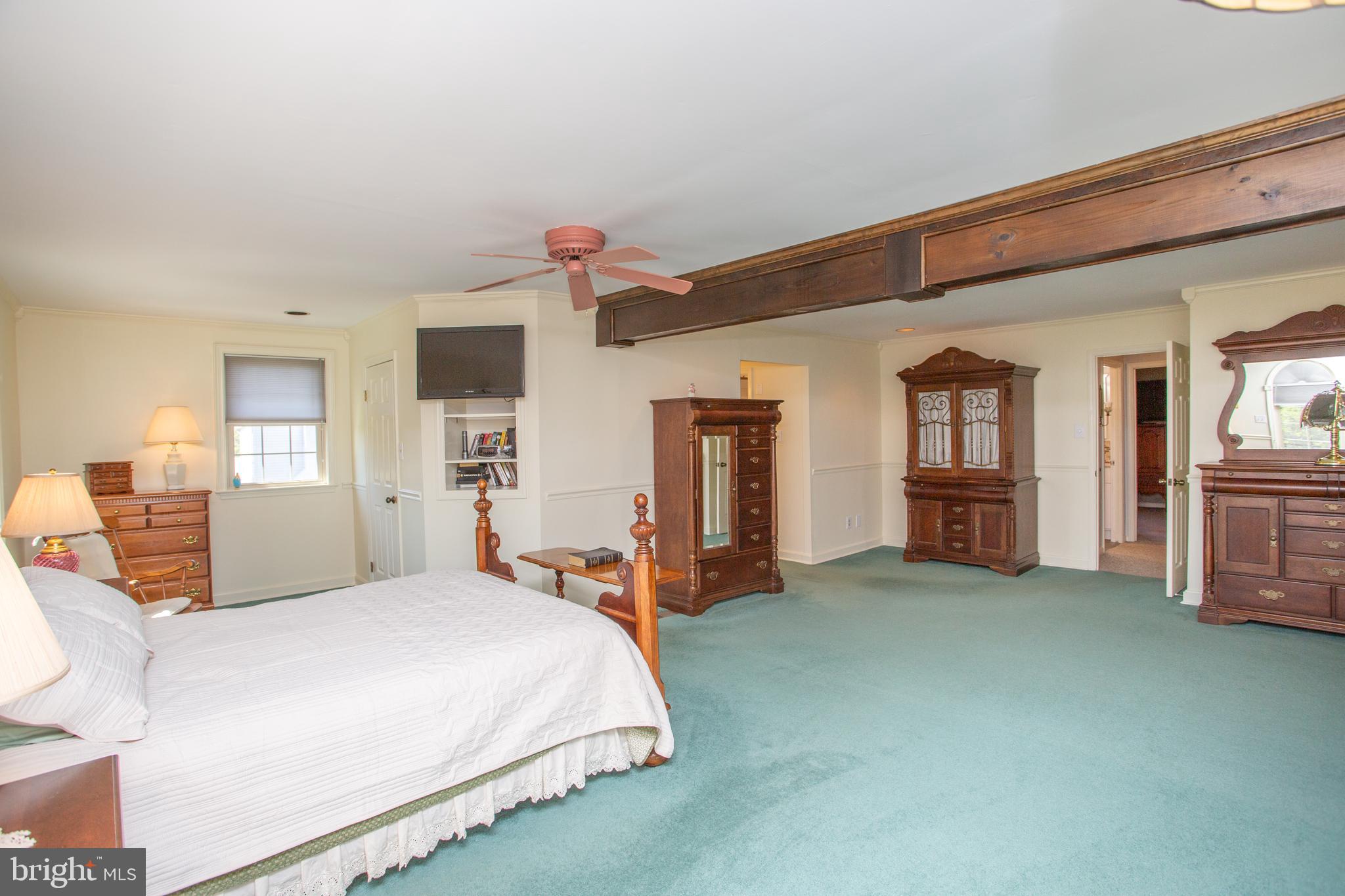 2018 Buckingham Drive Jamison, PA 18929 - Photo 13 of 28 a bedroom with a bed and wooden floor