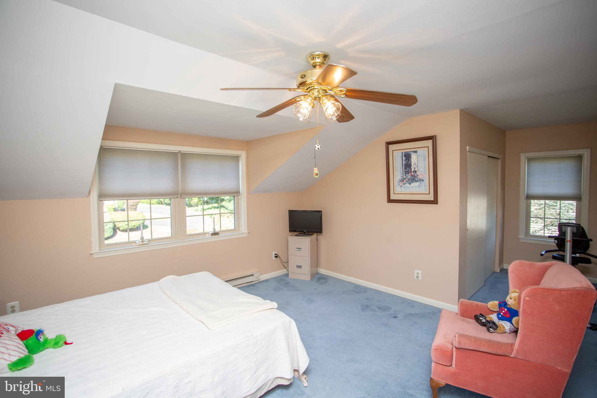 2018 Buckingham Drive Jamison, PA 18929 - Photo 16 of 28 a bedroom with a bed and a chandelier