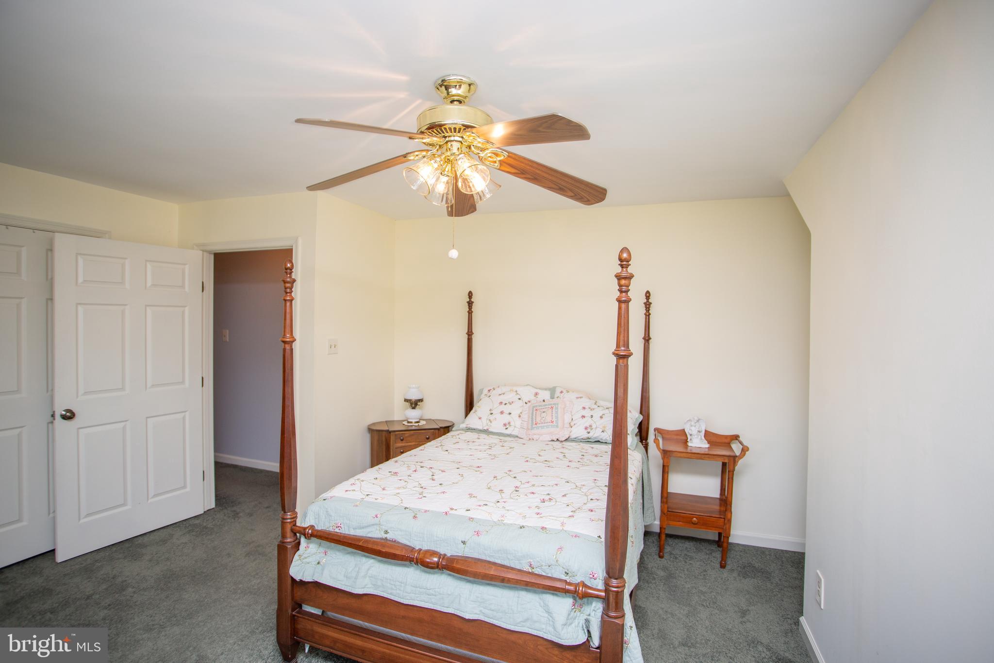 2018 Buckingham Drive Jamison, PA 18929 - Photo 17 of 28 a bedroom with a bed and a chandelier