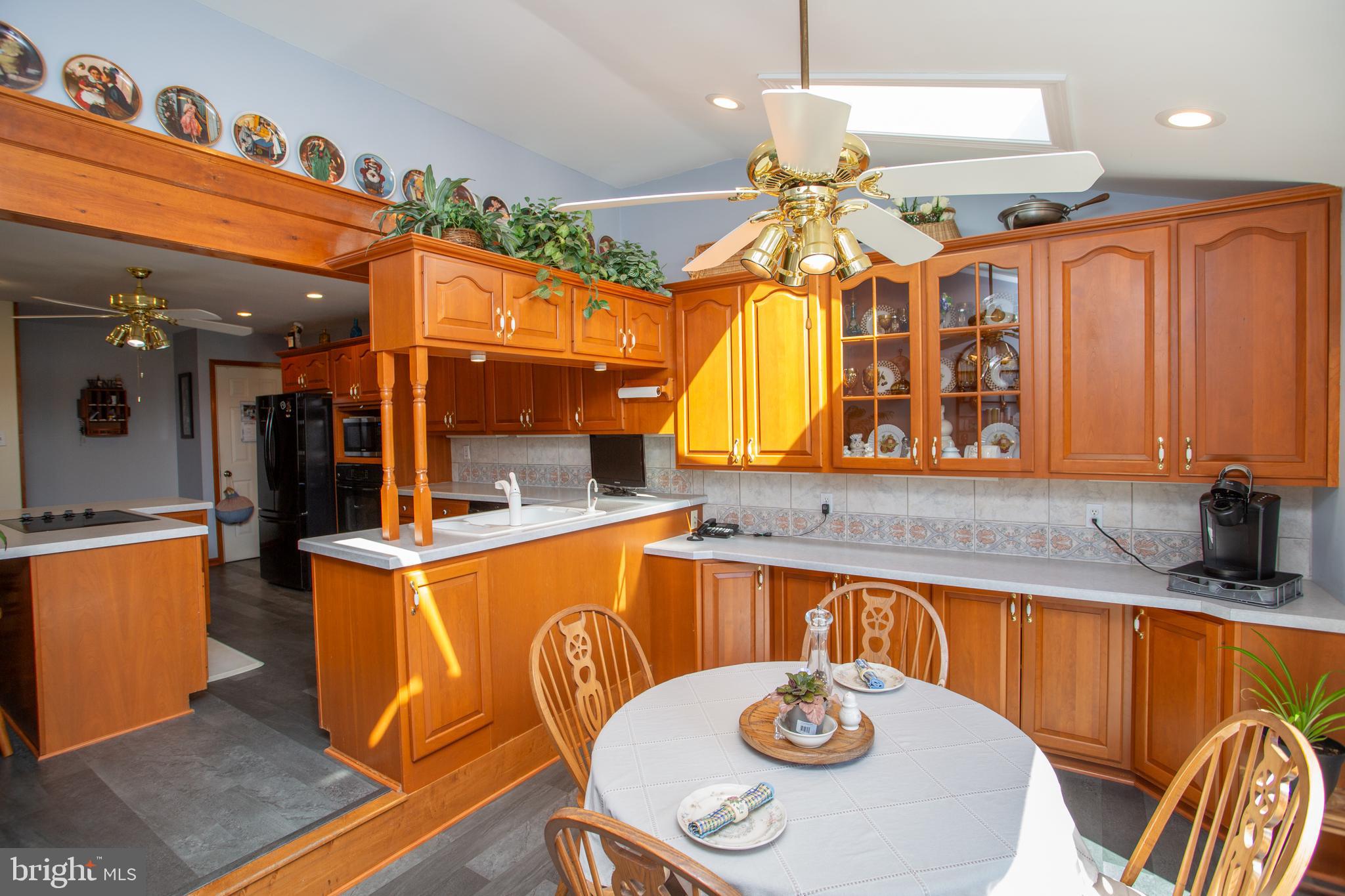 2018 Buckingham Drive Jamison, PA 18929 - Photo 8 of 28 a kitchen with a sink a stove and chairs