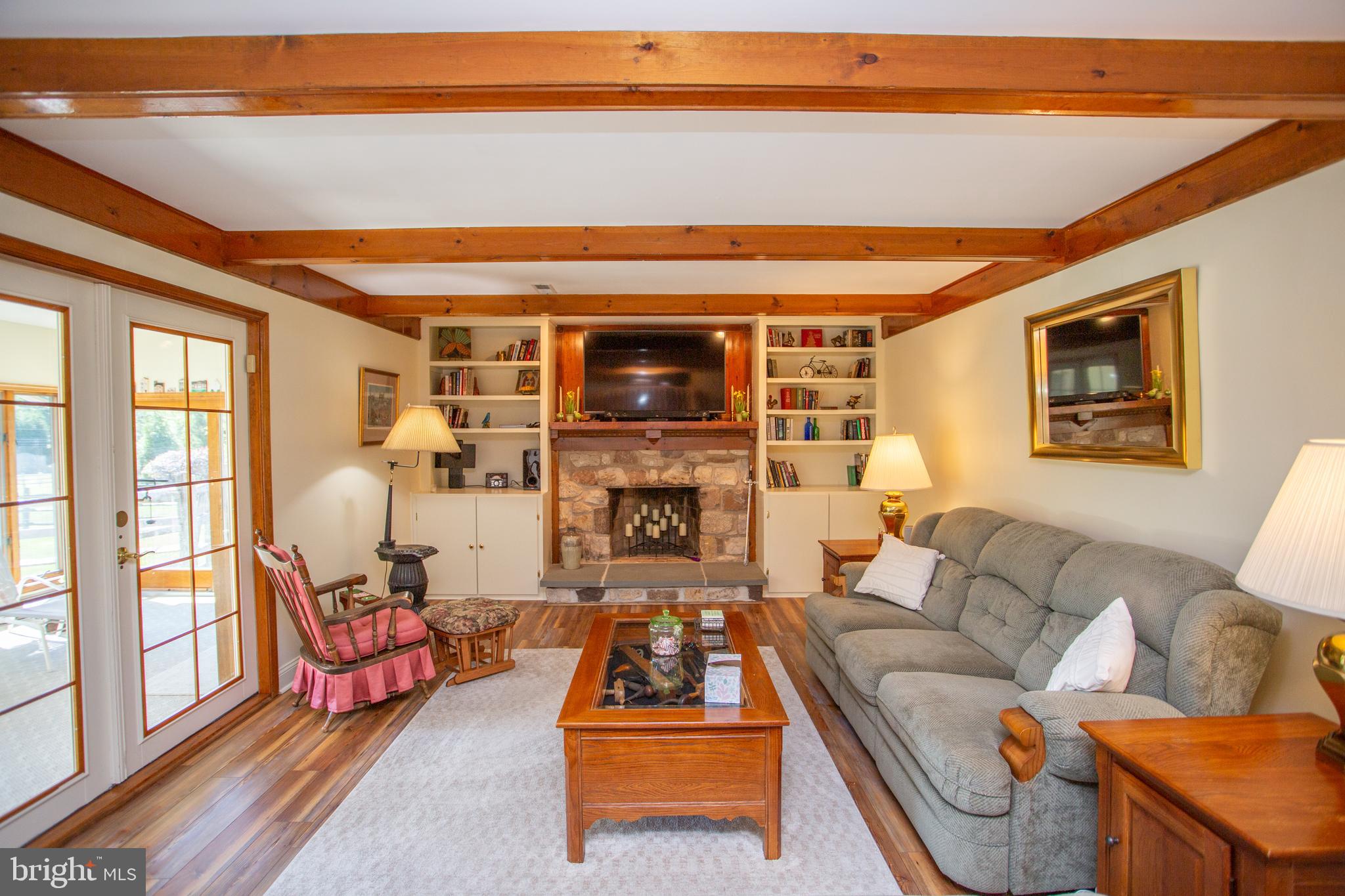 2018 Buckingham Drive Jamison, PA 18929 - Photo 9 of 28 a living room with furniture a flat screen tv and a floor to ceiling window