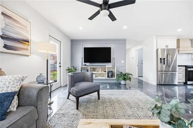 a living room with furniture and a flat screen tv
