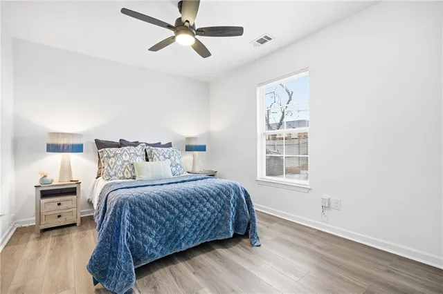 a bedroom with a large bed and a window