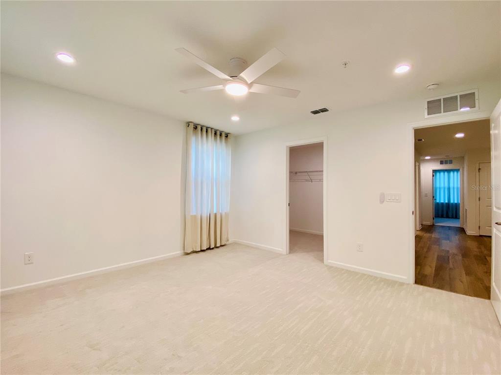 1577 Pinecliff Drive Apopka, FL 32703 - Photo 12 of 37 an empty room with fan and entrance