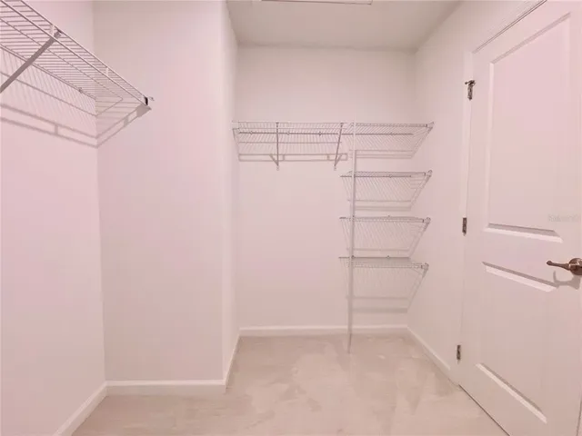 a view of an empty walk in closet