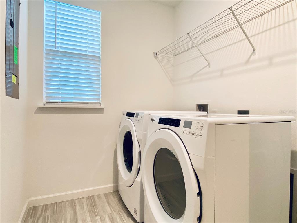 1577 Pinecliff Drive Apopka, FL 32703 - Photo 19 of 37 a utility room with dryer and washer