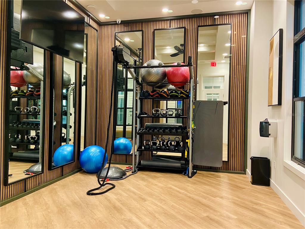 1577 Pinecliff Drive Apopka, FL 32703 - Photo 28 of 37 a view of a livingroom with furniture and gym equipment