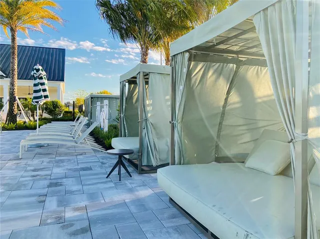 a view of swimming pool with outdoor seating and yard