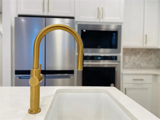 a kitchen with a stove and a sink