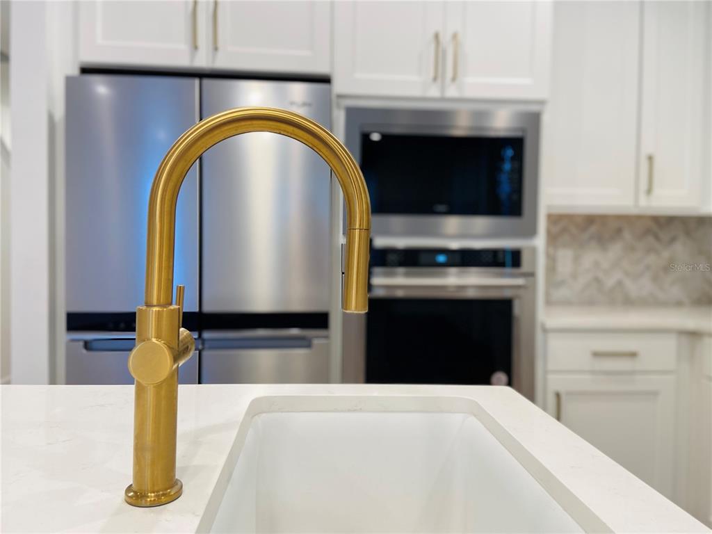 1577 Pinecliff Drive Apopka, FL 32703 - Photo 8 of 37 a kitchen with a stove and a sink