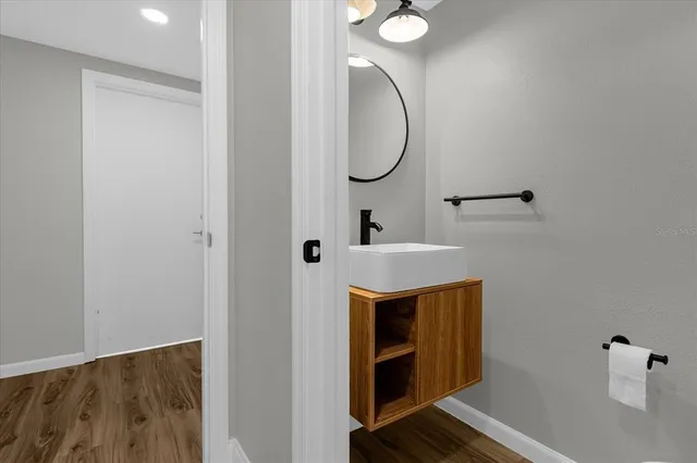 a bathroom with a sink and a mirror