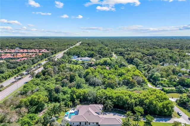 a aerial view of a house with a big yard