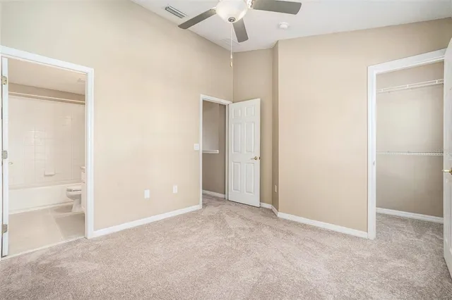 a view of an empty room with a bathroom