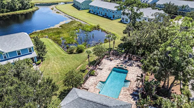 an aerial view of house with yard swimming pool and outdoor seating