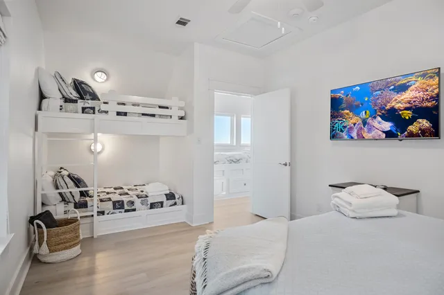 a bedroom with furniture and decor