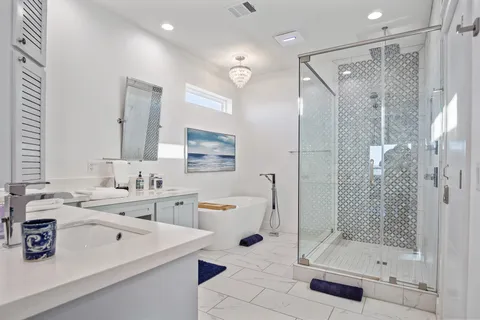 a view of bathroom with a shower sink and mirror