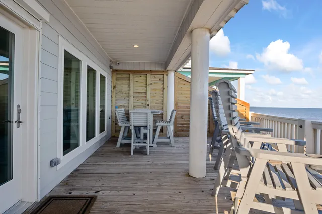 a dining room with furniture entryway and wooden floor