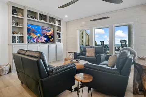 a living room with furniture workspace and a window