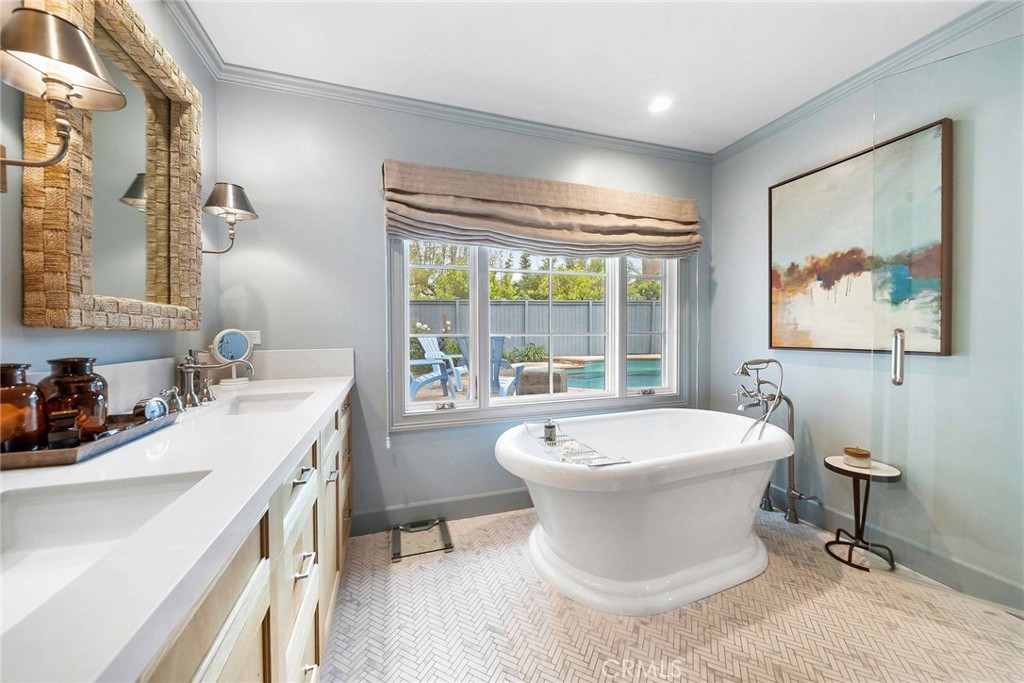 16544 Greenleaf Street Encino, CA 91436 - Photo 13 of 23 a bathroom with a sink and a mirror