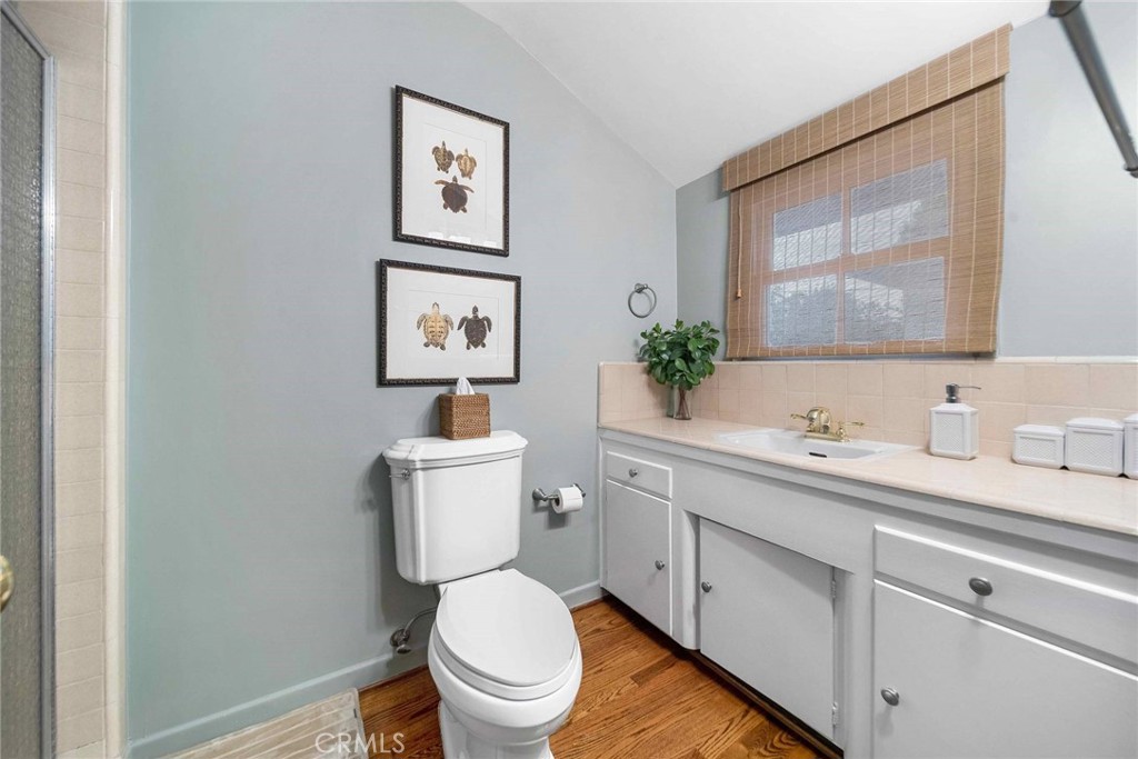 16544 Greenleaf Street Encino, CA 91436 - Photo 19 of 23 a bathroom with a toilet a sink and mirror