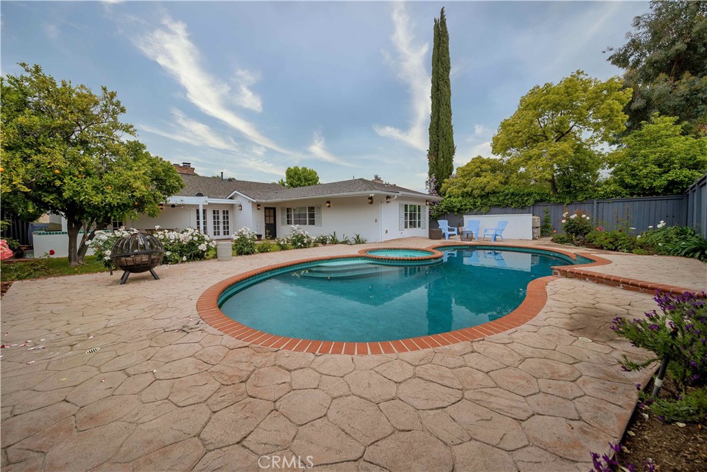 16544 Greenleaf Street Encino, CA 91436 - Photo 22 of 23 a swimming pool with outdoor seating and yard