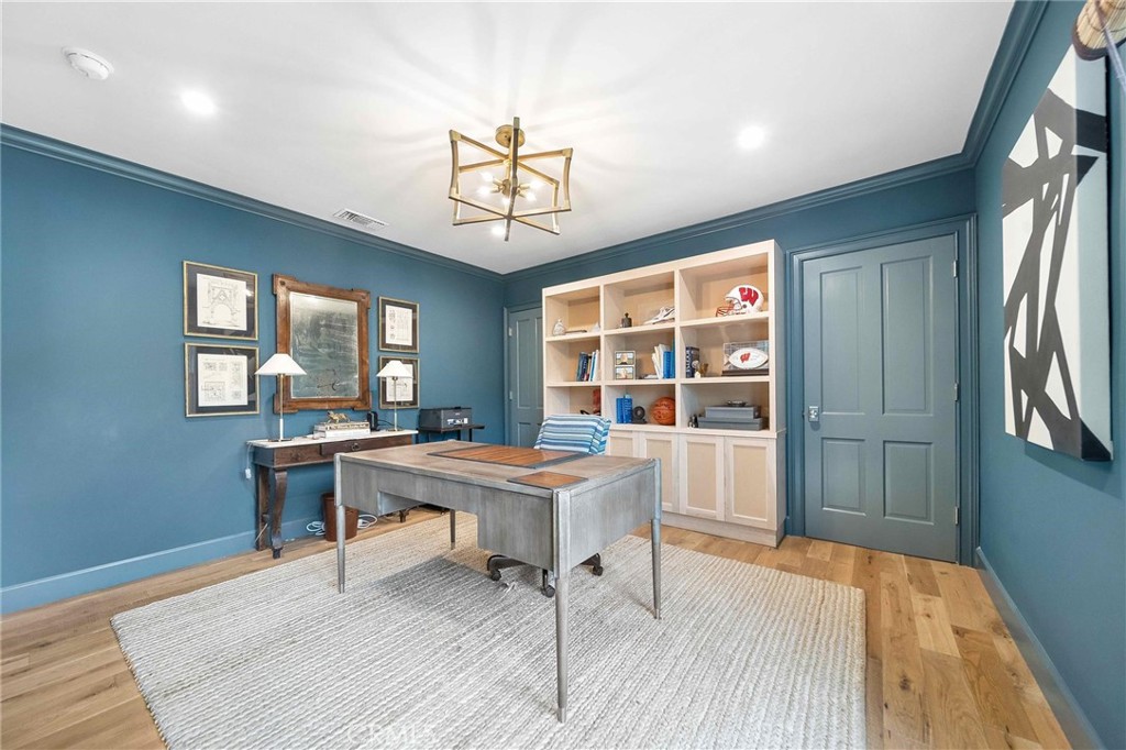 16544 Greenleaf Street Encino, CA 91436 - Photo 5 of 23 a view of a workspace with furniture window and wooden floor