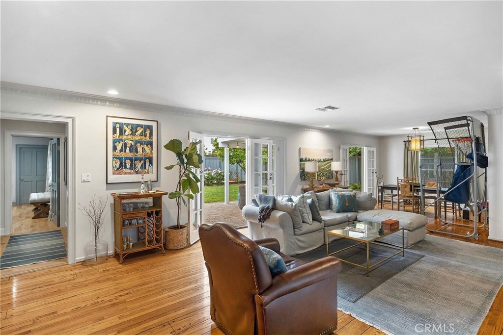 16544 Greenleaf Street Encino, CA 91436 - Photo 6 of 23 a living room with furniture and a fireplace
