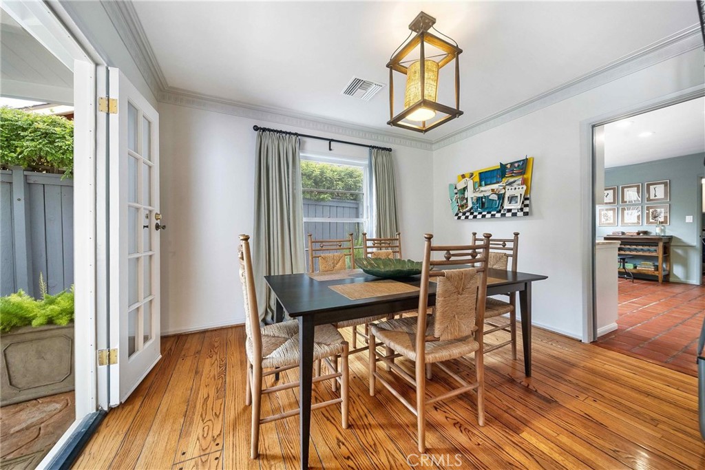 16544 Greenleaf Street Encino, CA 91436 - Photo 7 of 23 a view of a dining room with furniture and a window