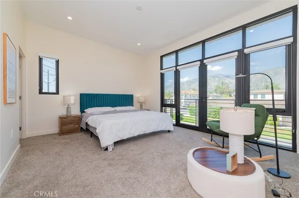 a bedroom with furniture and a window